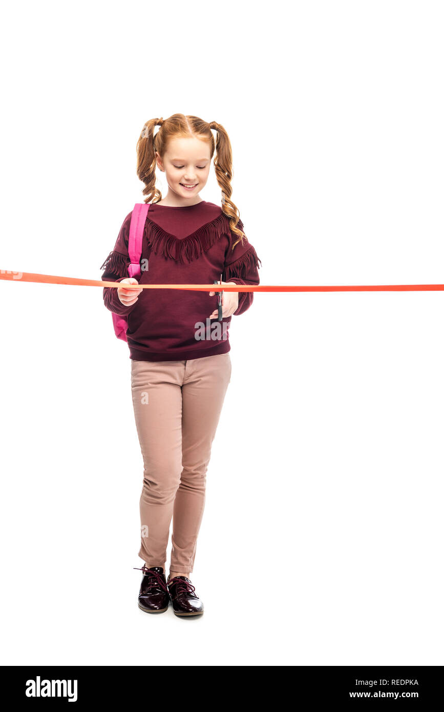 Lächelnd Schulmädchen schneiden red ribbon isoliert auf weißem Stockfoto
