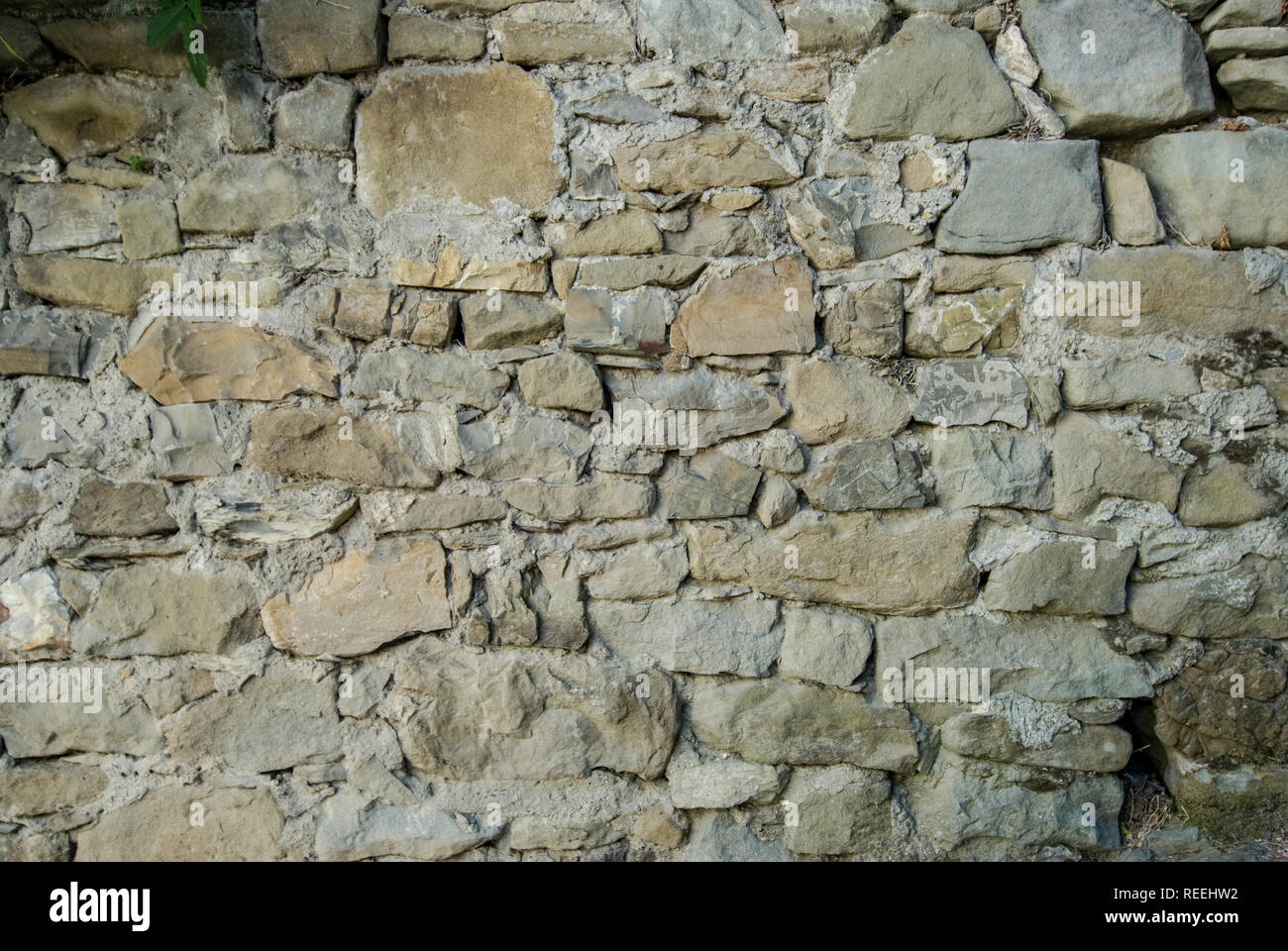 Strukturierten Hintergrund von unregelmäßigen Steinen platziert Stockfoto