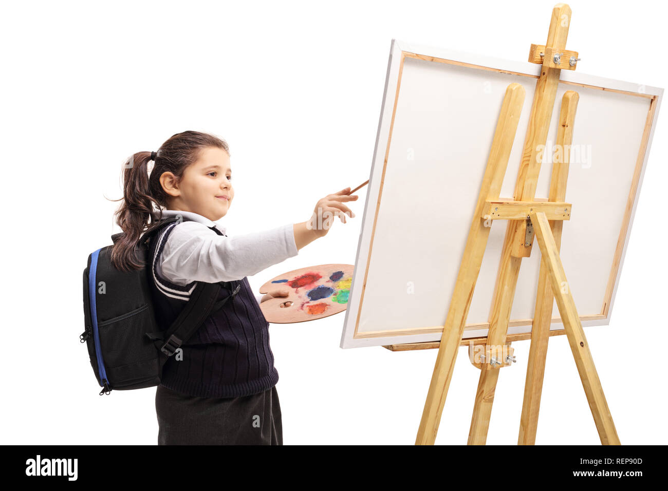 Schulmädchen Malerei auf einer Leinwand auf weißem Hintergrund Stockfoto