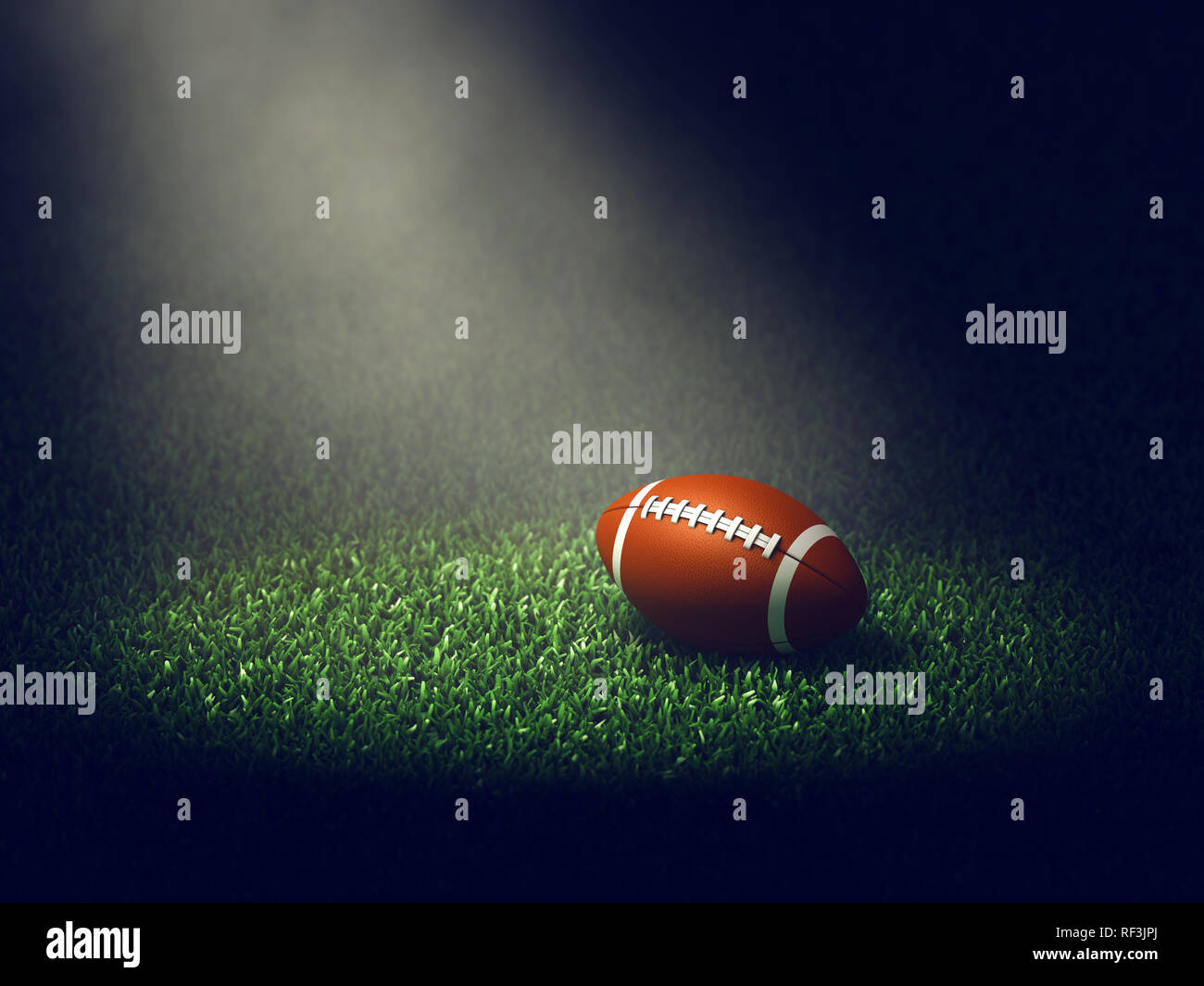 American football Ball auf Gras leuchtet von Spotlight, Sport Arena Stockfoto