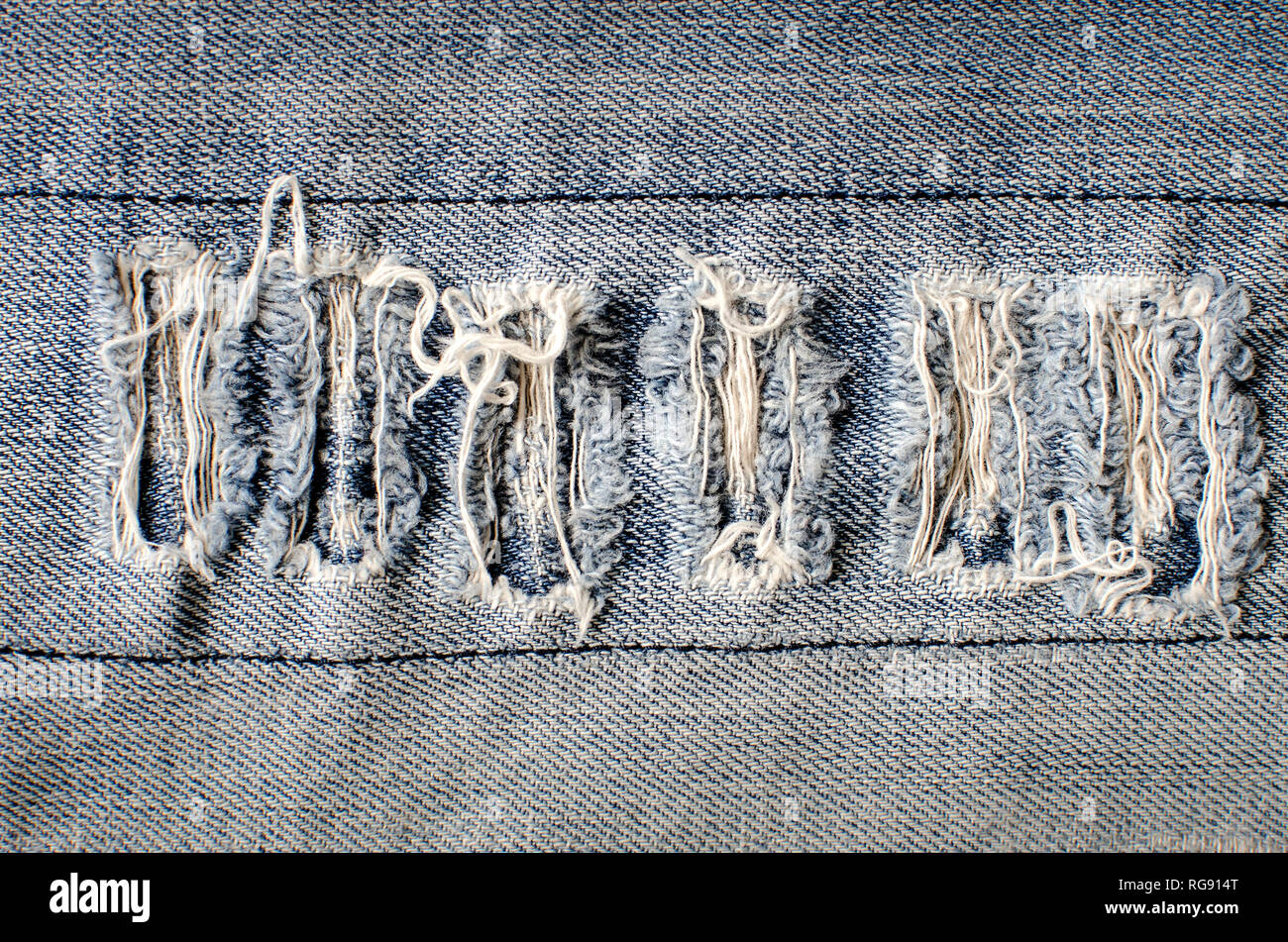 Denim Jeans Textur oder Jeans Hintergrund mit alten zerrissenen Stockfoto