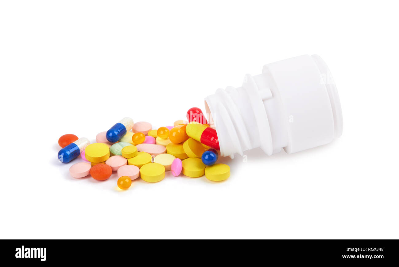 Vitamine Pillen und Tabletten in der Flasche auf weißem Hintergrund Stockfoto