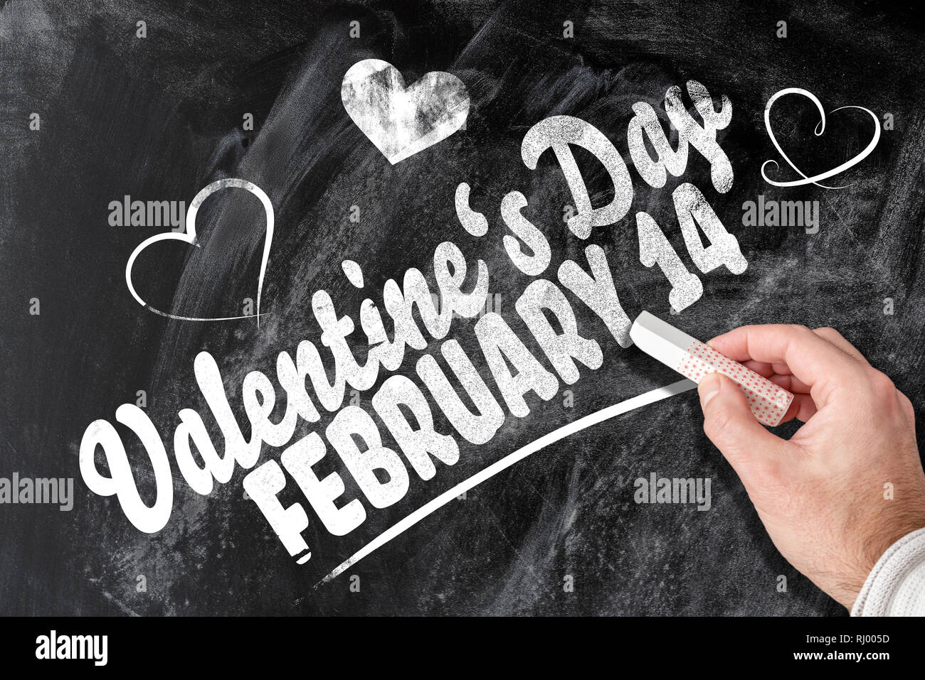 Valentinstag am 14. Februar Erinnerung auf Schiefertafel geschrieben Stockfoto