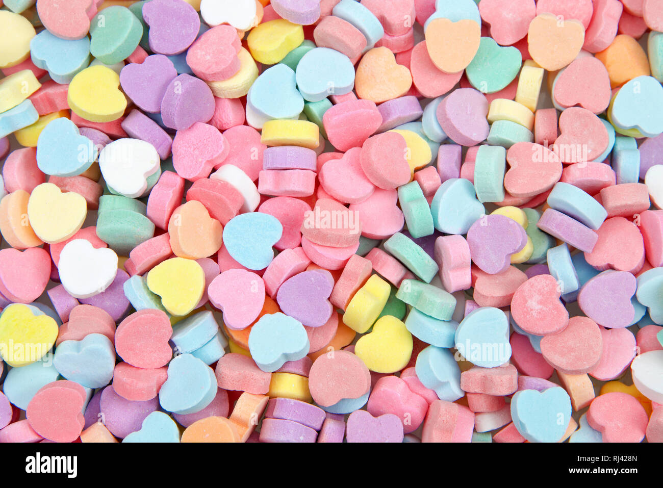 Hintergrund der bunten Süßigkeiten Herzen zum Valentinstag. Stockfoto