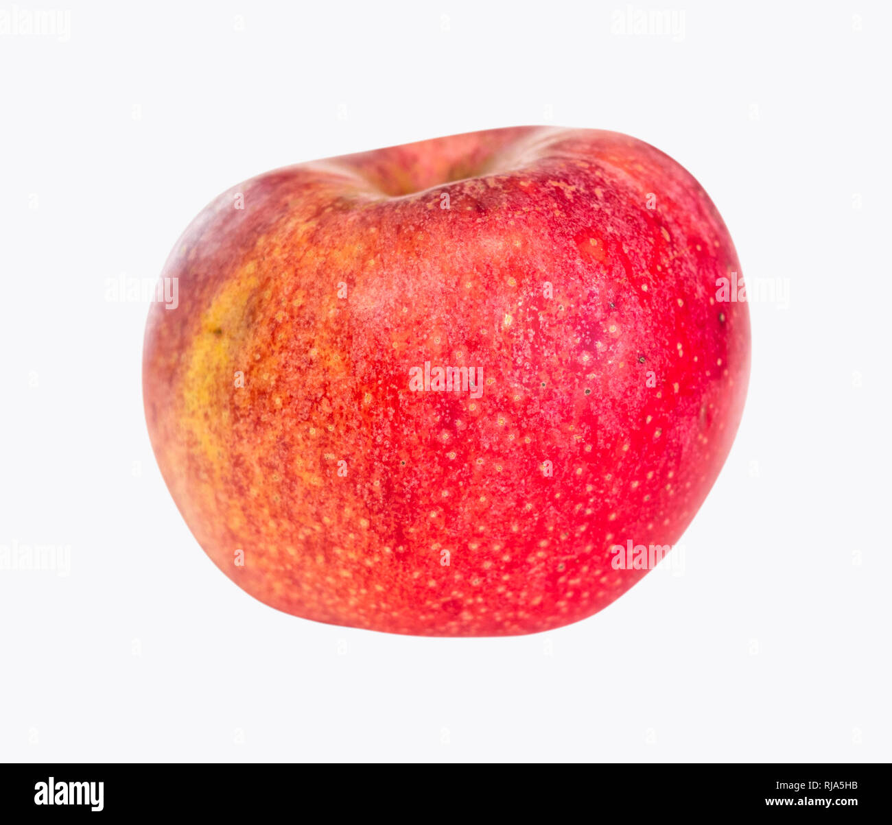 Ganze reife rote Apfel Obst auf dem Teller auf weißem Hintergrund Stockfoto