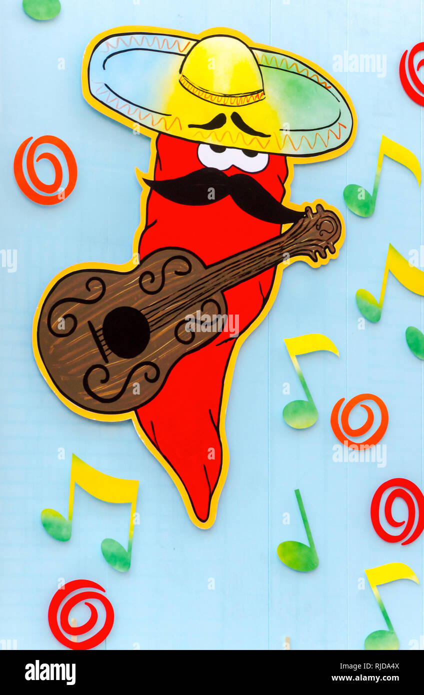 Eine rote Chili spielt die guitar​ auf ein Fenster im El Ranchero mexikanische Restaurant, Feb.14, 2015 in Selma, Alabama. Stockfoto