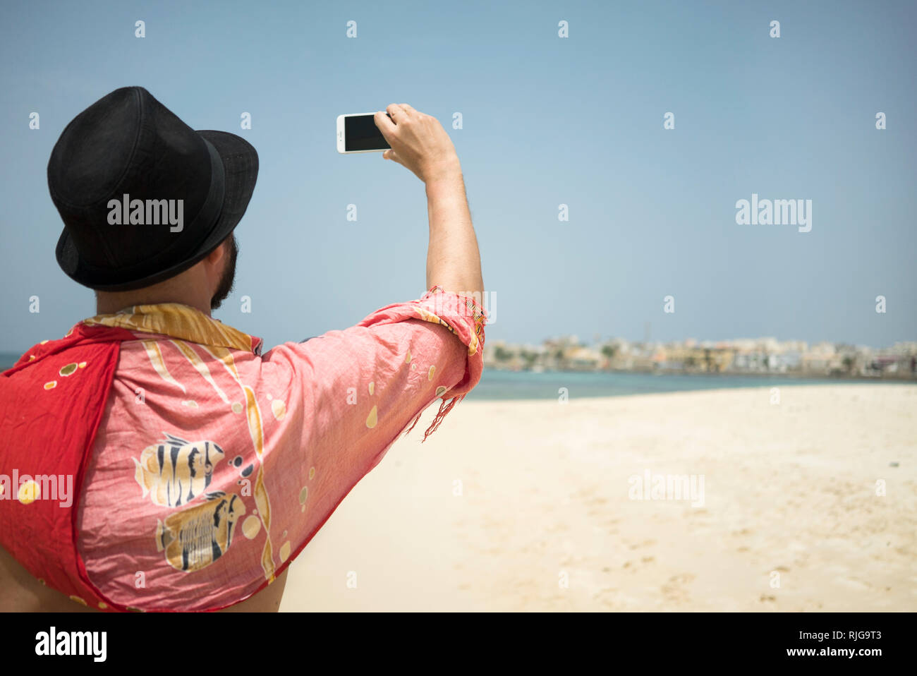 Mann Foto am Strand Stockfoto