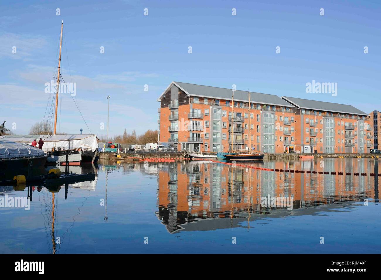 Baggerarbeiten im Becken von Gloucester Docks auf der Gloucester und Schärfe Canal Stockfoto