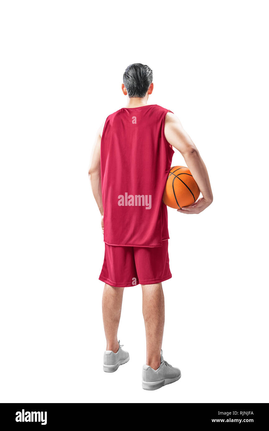 Ansicht der Rückseite des asiatischer Mann im Basketball einheitliche Halte den Ball auf weißem Hintergrund Stockfoto