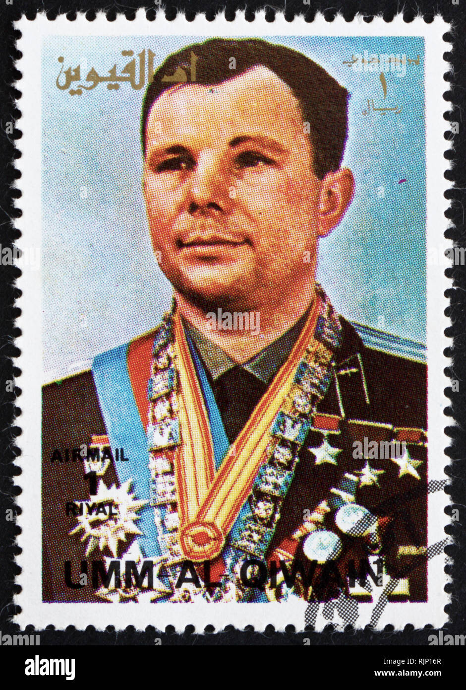 UMM AL-QUWAIN - ca. 1972: einen Stempel in der Umm al-Quwain gedruckt zeigt Yuri A. Gagarin, Astronaut, der erste Mensch im Weltraum, ca. 1972 Stockfoto