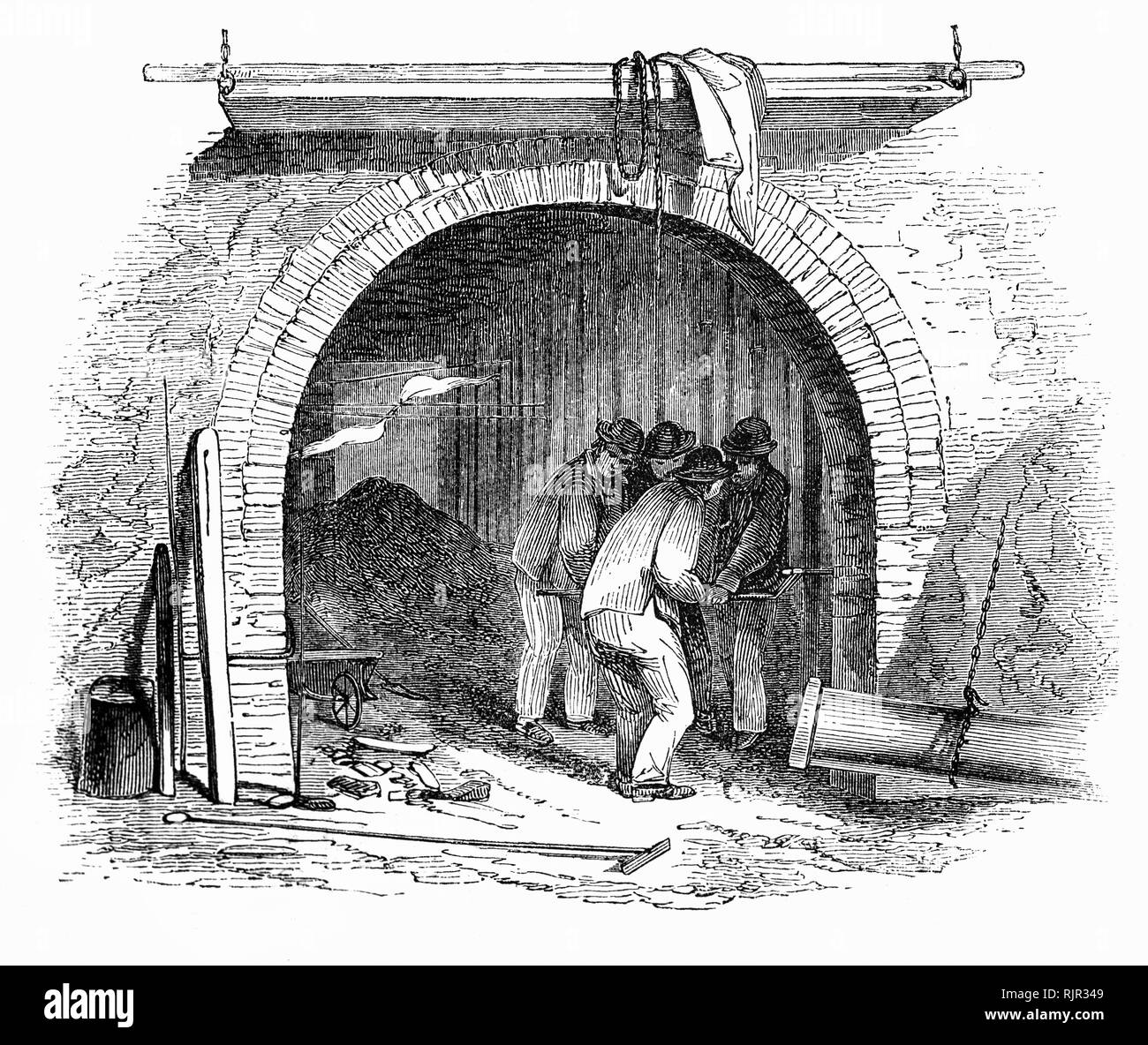 Das grundlegende Verfahren zur Herstellung von Gas aus Kohle im frühen 19. Jahrhundert blieb im Wesentlichen unverändert bis die letzte Kohle Gas arbeitet in den 1970er Jahren geschlossen. Als er erkannte, daß es effizienter wäre, Gas über einen längeren Zeitraum zu machen und lagern Sie es das erste Gas Inhaber nur ein "bell" schweben in einen Tank mit Wasser bestand. Die Abbildung zeigt die Gas Fabrikarbeiter Einschalten der Netzspannung in die Stadt. Stockfoto