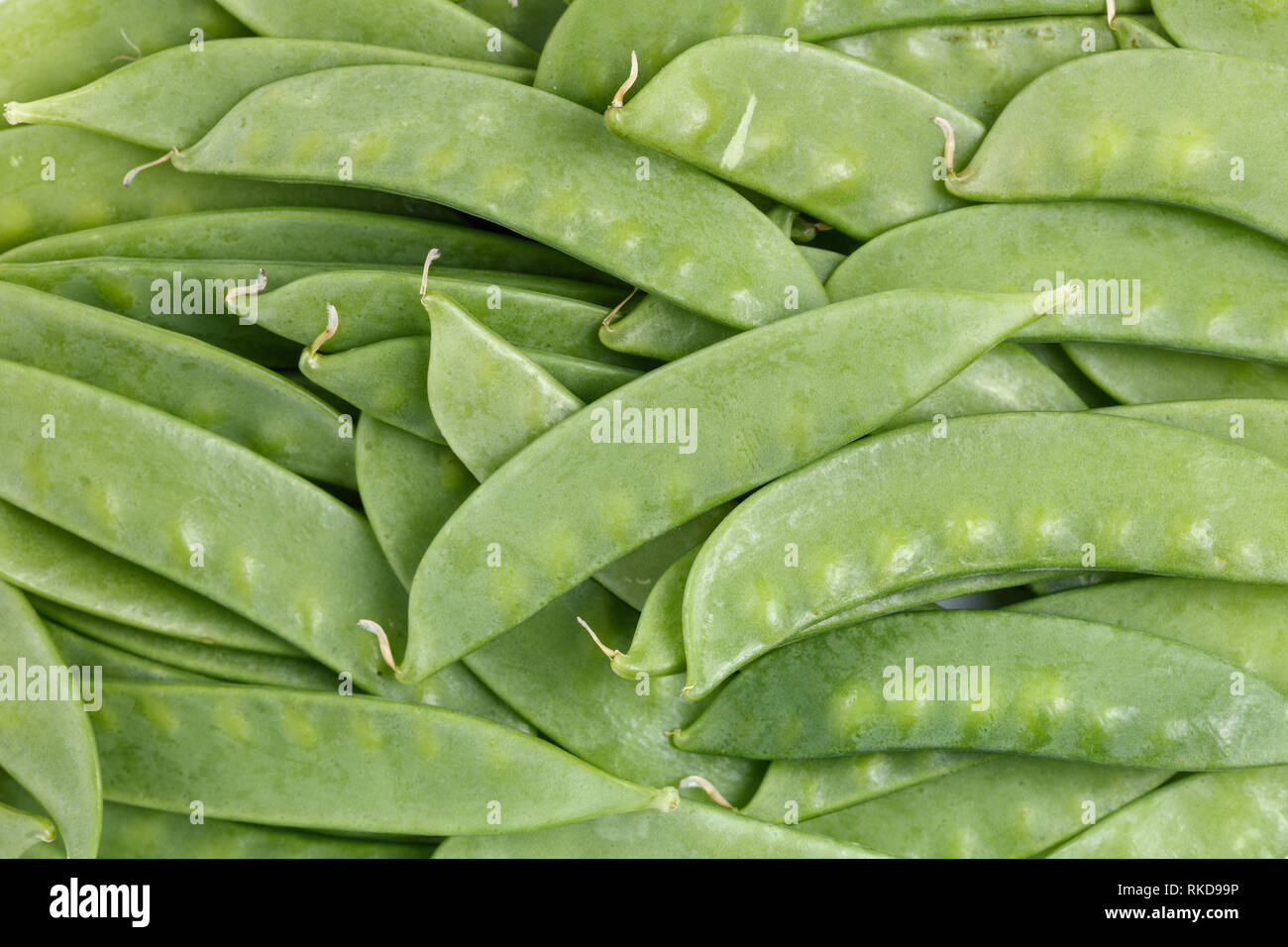 Grüne frische Zuckerschoten Hintergrund Nahaufnahme Stockfoto