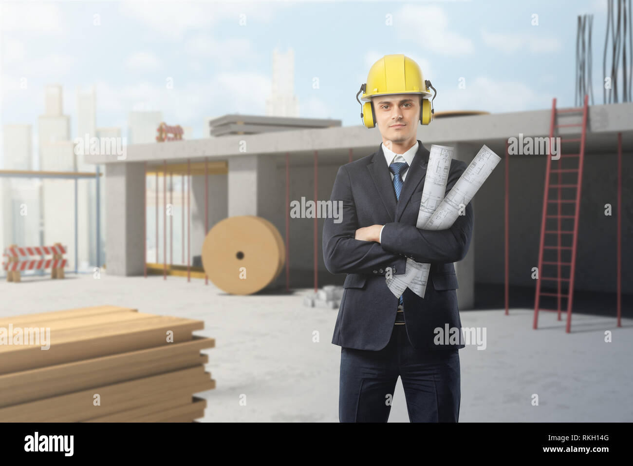 Junge Unternehmer tragen gelbe Helm und Holding Blueprints auf Baustelle Stockfoto