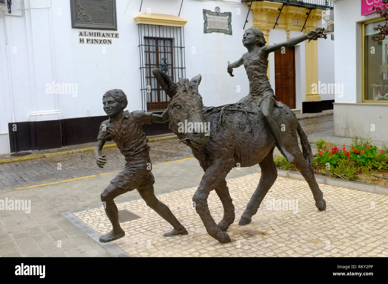 Bronze Skulpturen von Kindern und Esel, Moguer, Huelva, Spanien Stockfoto