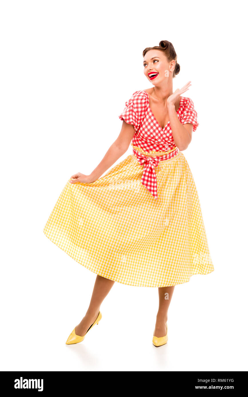 Schönen Pin up Girl in hellen Vintage Kleidung auf High Heels isoliert auf weißem Posing Stockfoto