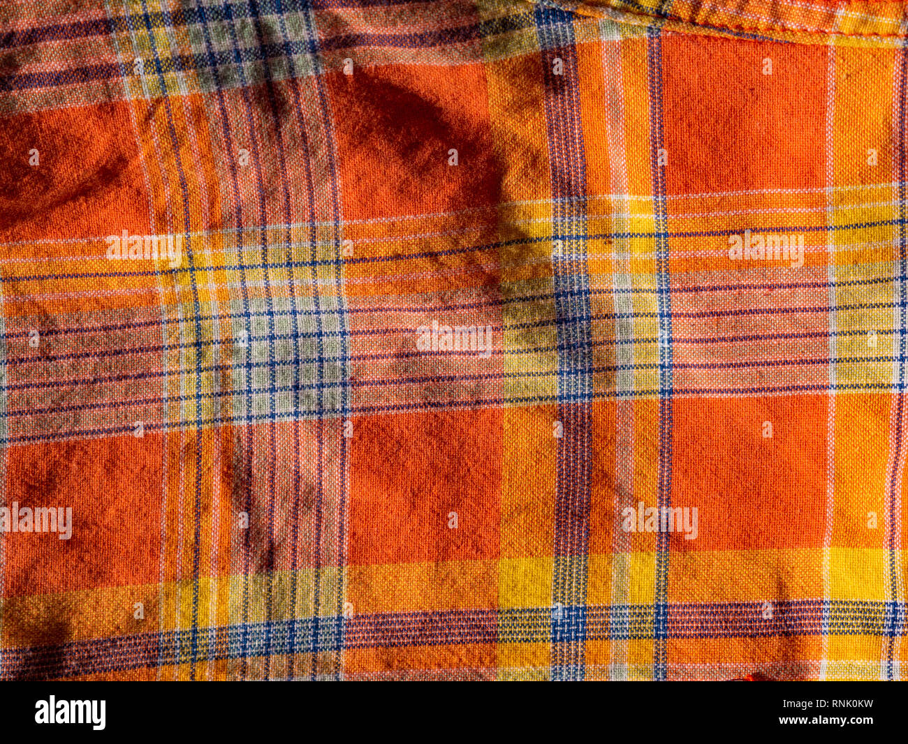 Orange und gelb karierte Drucken als Hintergrund. Scottish tartan Muster. Symmetrische rhombus Muster. Stockfoto