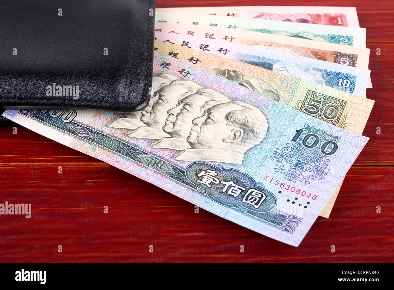 Alte chinesische Geld in der schwarzen Mappe Stockfoto