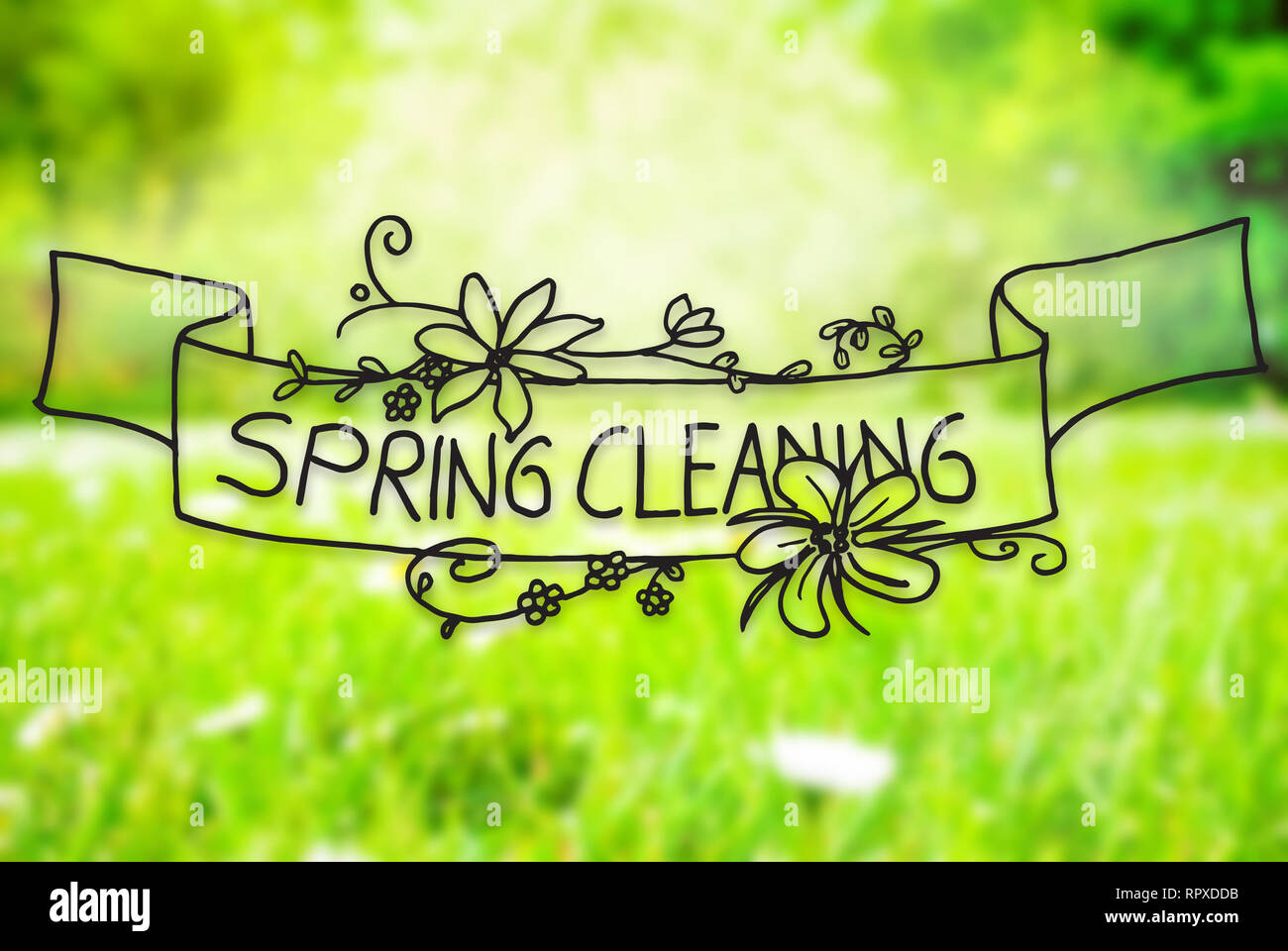 Englisch Kalligraphie Frühjahrsputz. Sonnige Frühling Gras Wiese mit Gänseblümchen Blumen Stockfoto