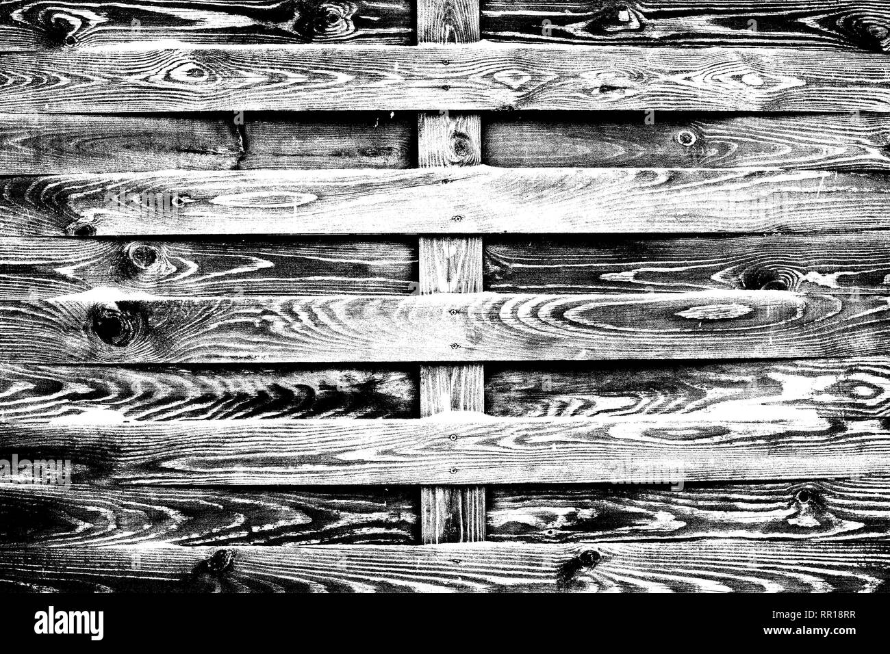 Alten hölzernen Zaun der ungeplanten Planken, schwarze und weiße Textur mit hohem Kontrast Stockfoto