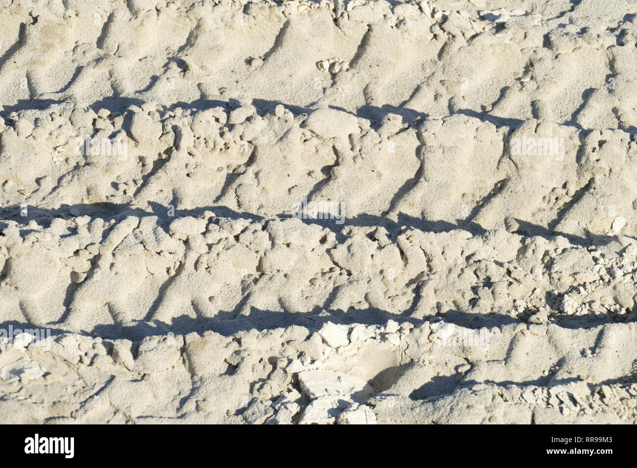 Schmierspuren, Sand, Braun sand Oberfläche, Schatten, Hintergrund, Textur Stockfoto