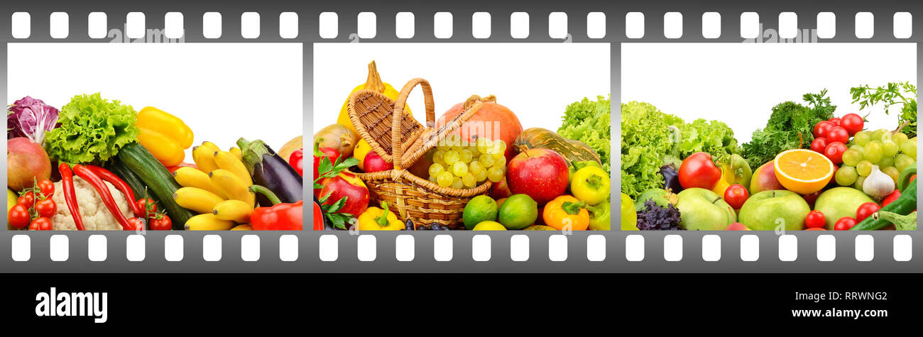 Reife Früchte und Gemüse im Rahmen der fotografischen Film auf weißem Hintergrund. Stockfoto