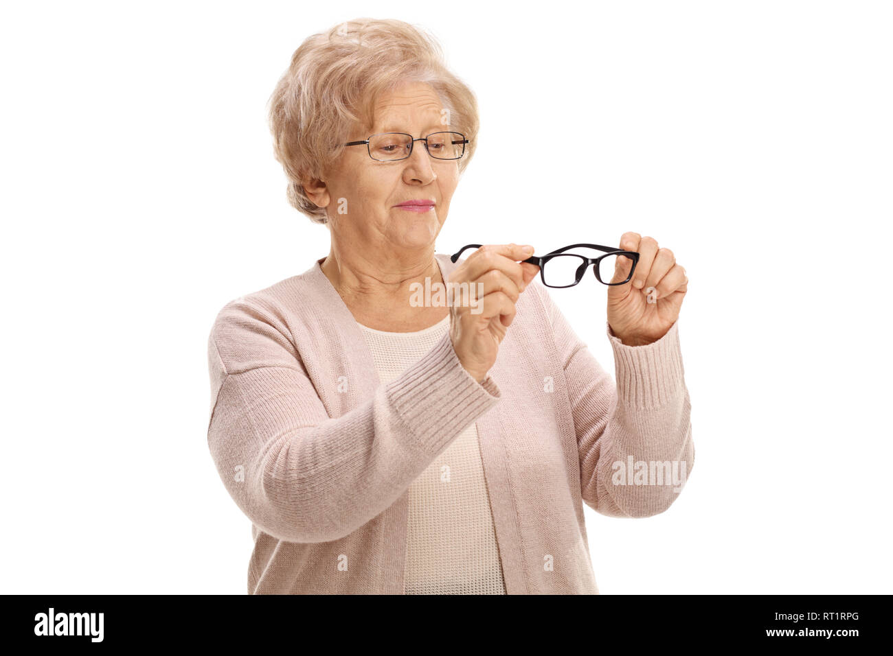 Ältere Frau mit ein paar neue Gläser für Augen und Sie isoliert auf weißem Hintergrund Stockfoto