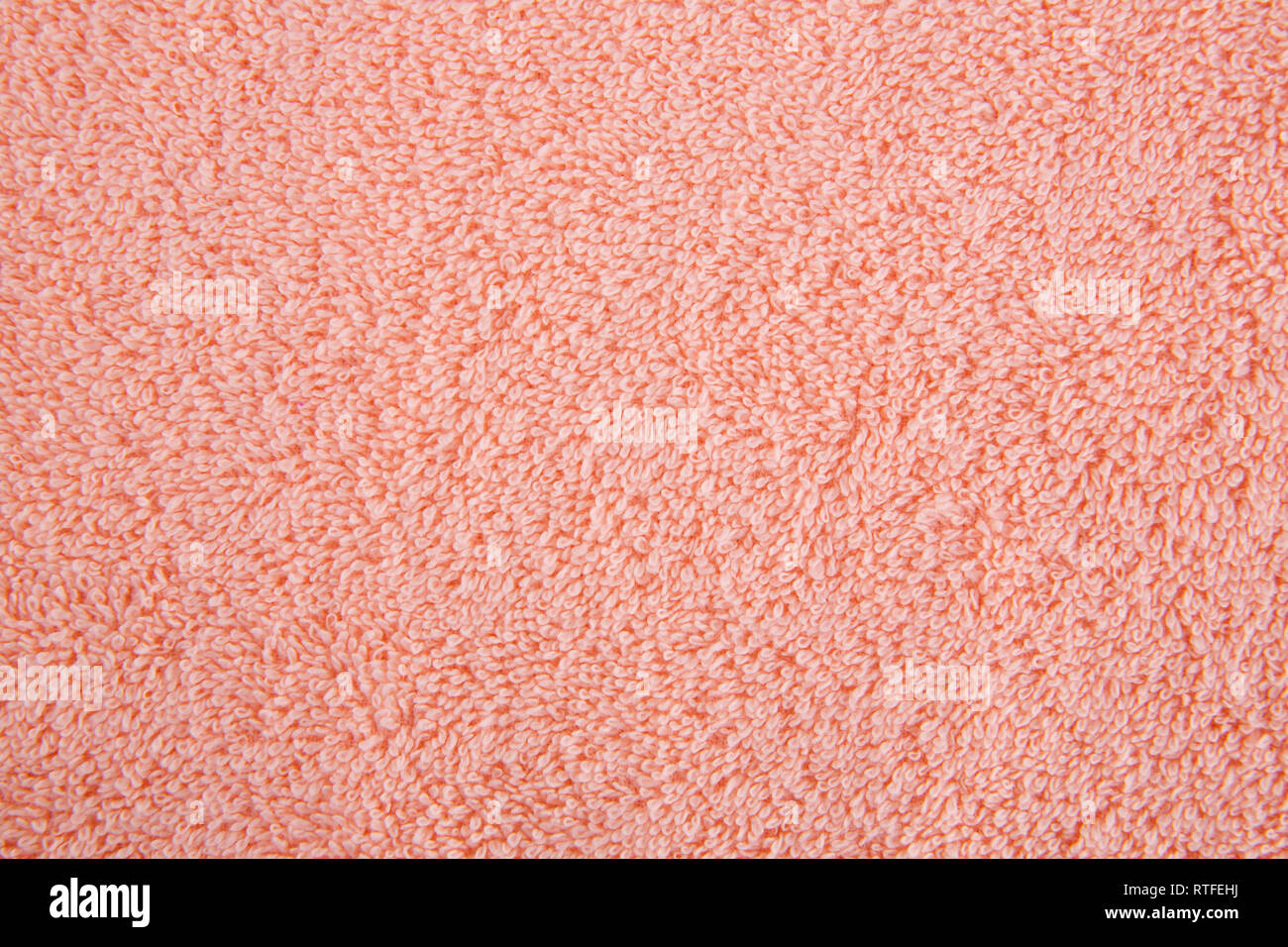 Pfirsich Farbe Handtuch Textur als Hintergrund, Nahaufnahme Bild. Stockfoto