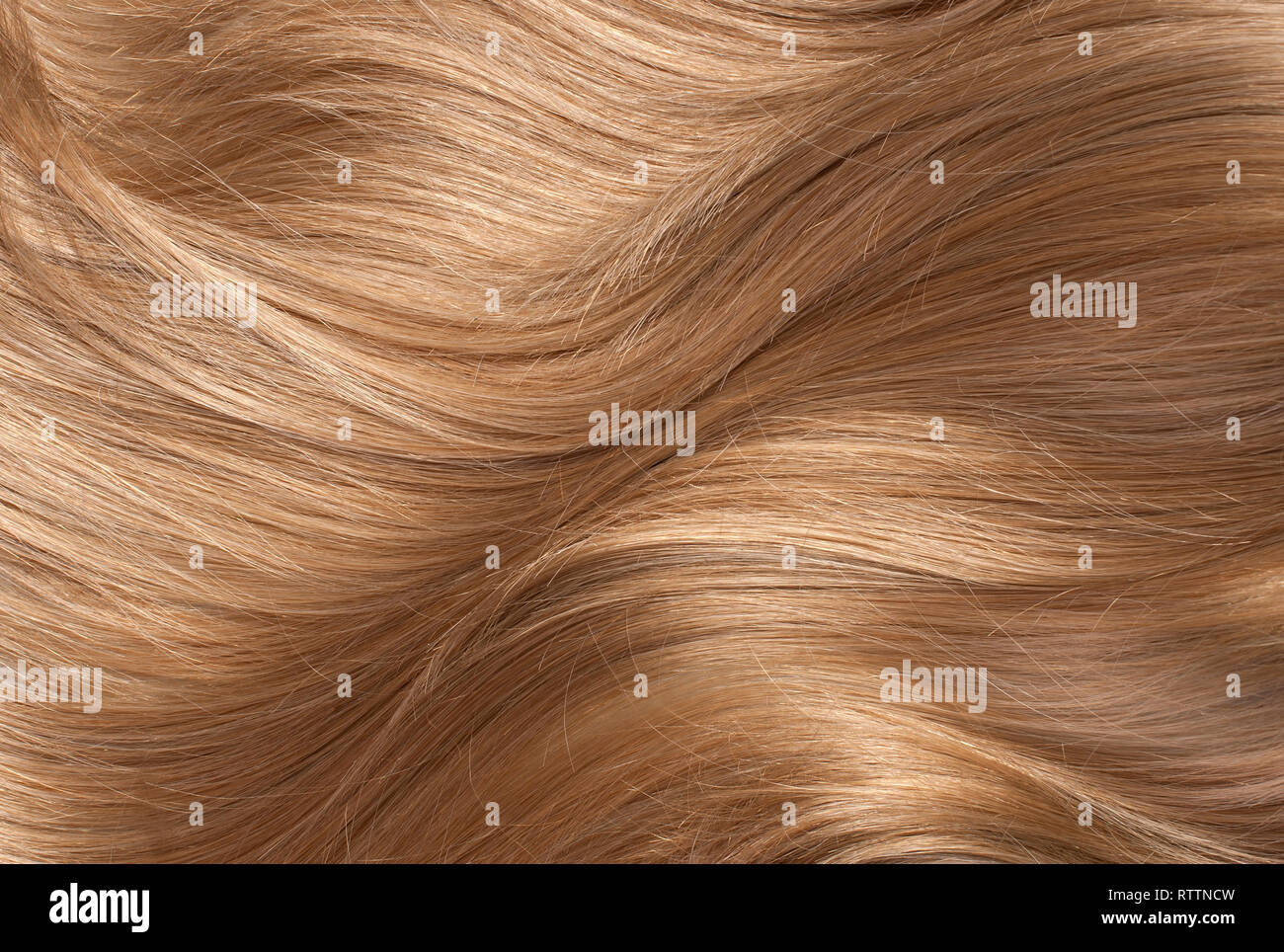 Welliges blondes Echthaar Hintergrund Stockfoto
