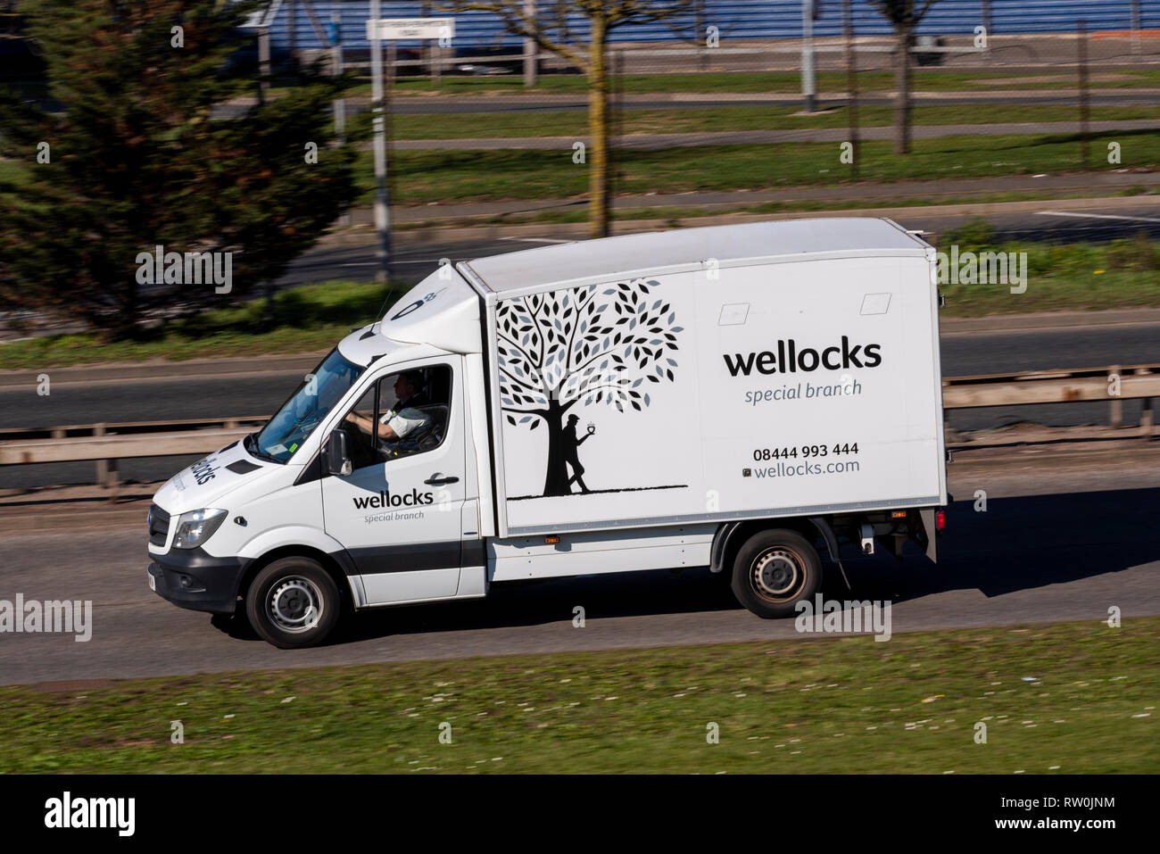 Wellocks Special Branch Lieferwagen fahren auf der Straße. Die Anbieter von Obst, Gemüse, Milchprodukte, Geflügel, Fleisch, Verbrauchsmaterialien, vorratsschrank Essentials Stockfoto