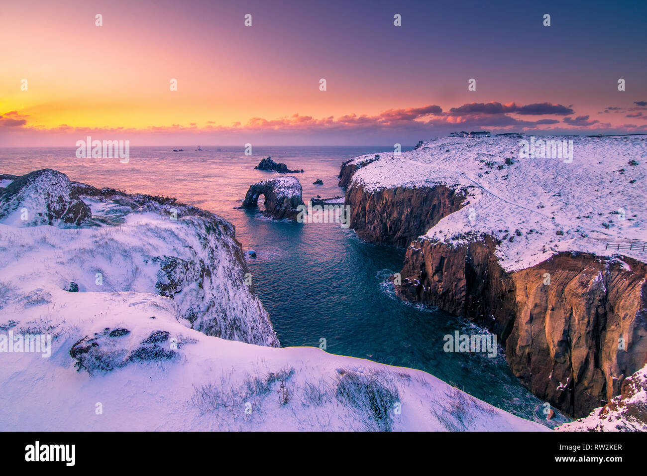 Land's End Cornwall Arch Schneesturm Sonnenuntergang Tier des Ostens UK 2018 Stockfoto