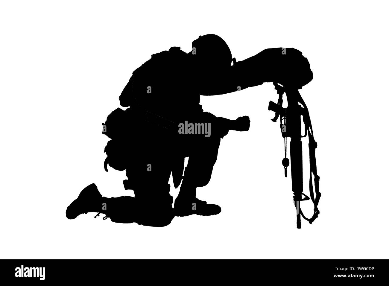 Silhouette eines Soldaten Knien in Respekt für einen gefallenen Kameraden. Stockfoto