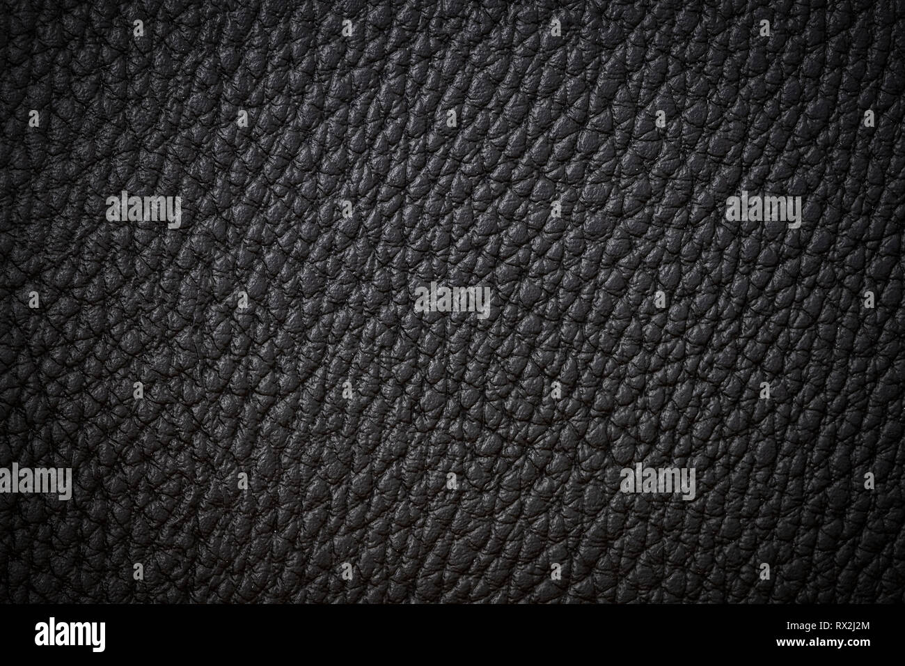 Schwarz Leder close-up Hintergrund dunkler Hintergrund Textur schwarz Leder Stockfoto