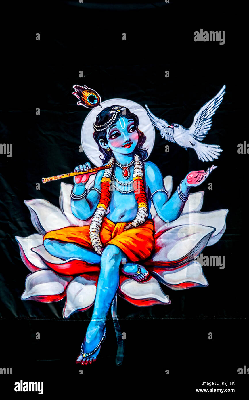 Hindu Gott Krishna sitzt auf einer Lotusblüte. Bhaktivedanta Manor, Watford, Großbritannien Stockfoto