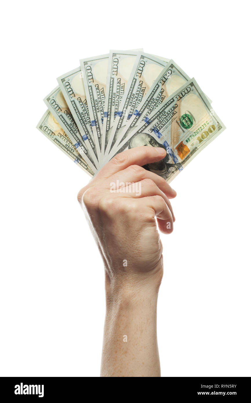 Hundert Dollar Scheine in der Hand des Menschen isoliert auf Weiss. Hand mit amerikanischen 100 Dollar Bargeld beachten Stockfoto