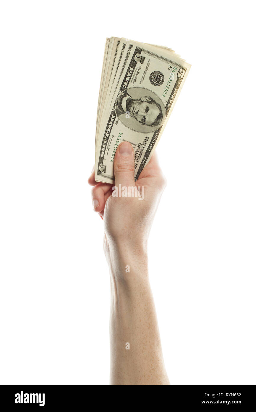Hand mit US Dollar Geld auf weißem Hintergrund. Amerikanische Dollar Banknoten zu 5 Stockfoto