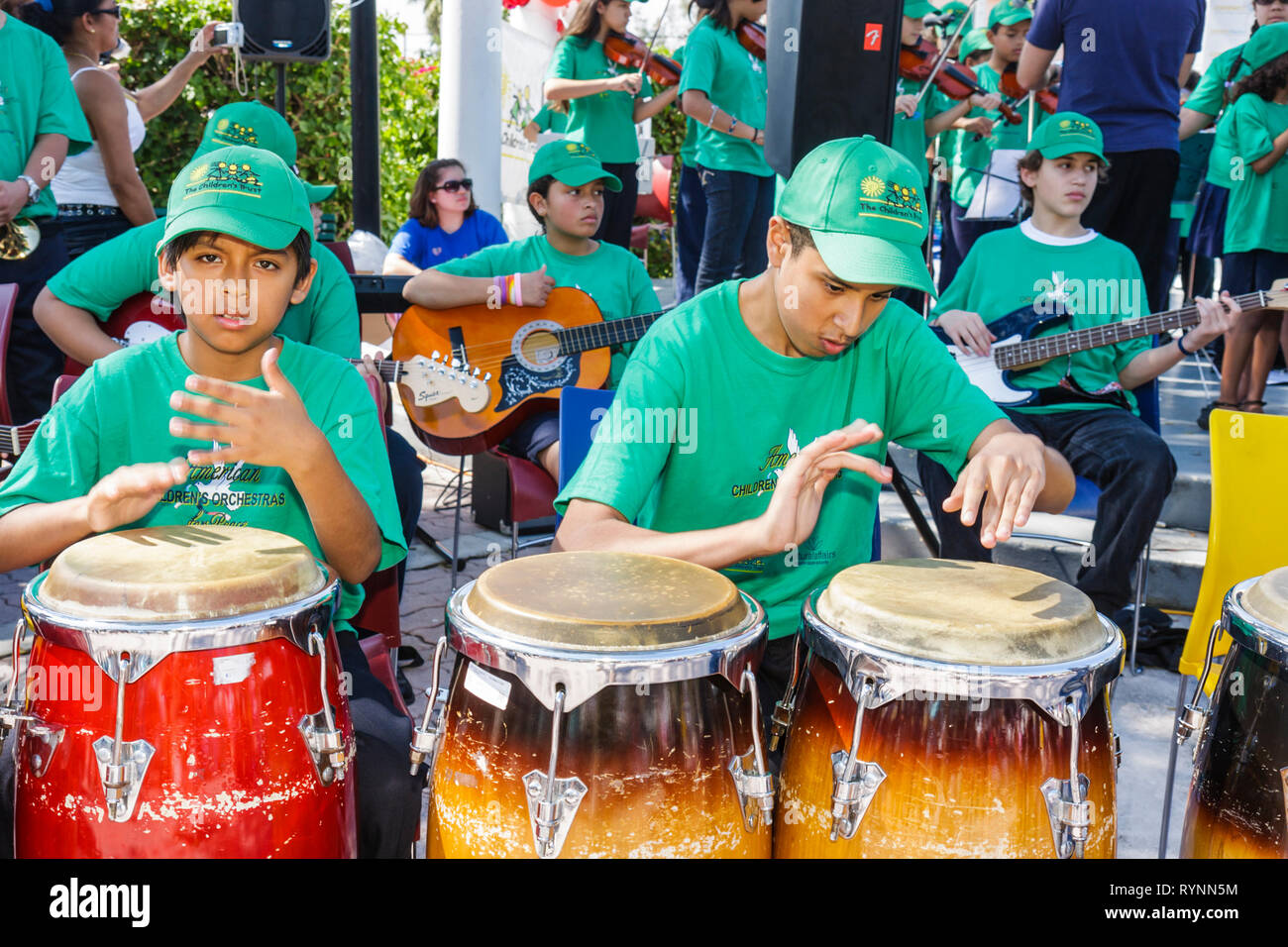 Miami Florida,Little Havana,Jose Marti Park,United Hearts Family Festival,American Children's Orchestra for Peace,Hispanic boys teen teens Teenagers,s Stockfoto