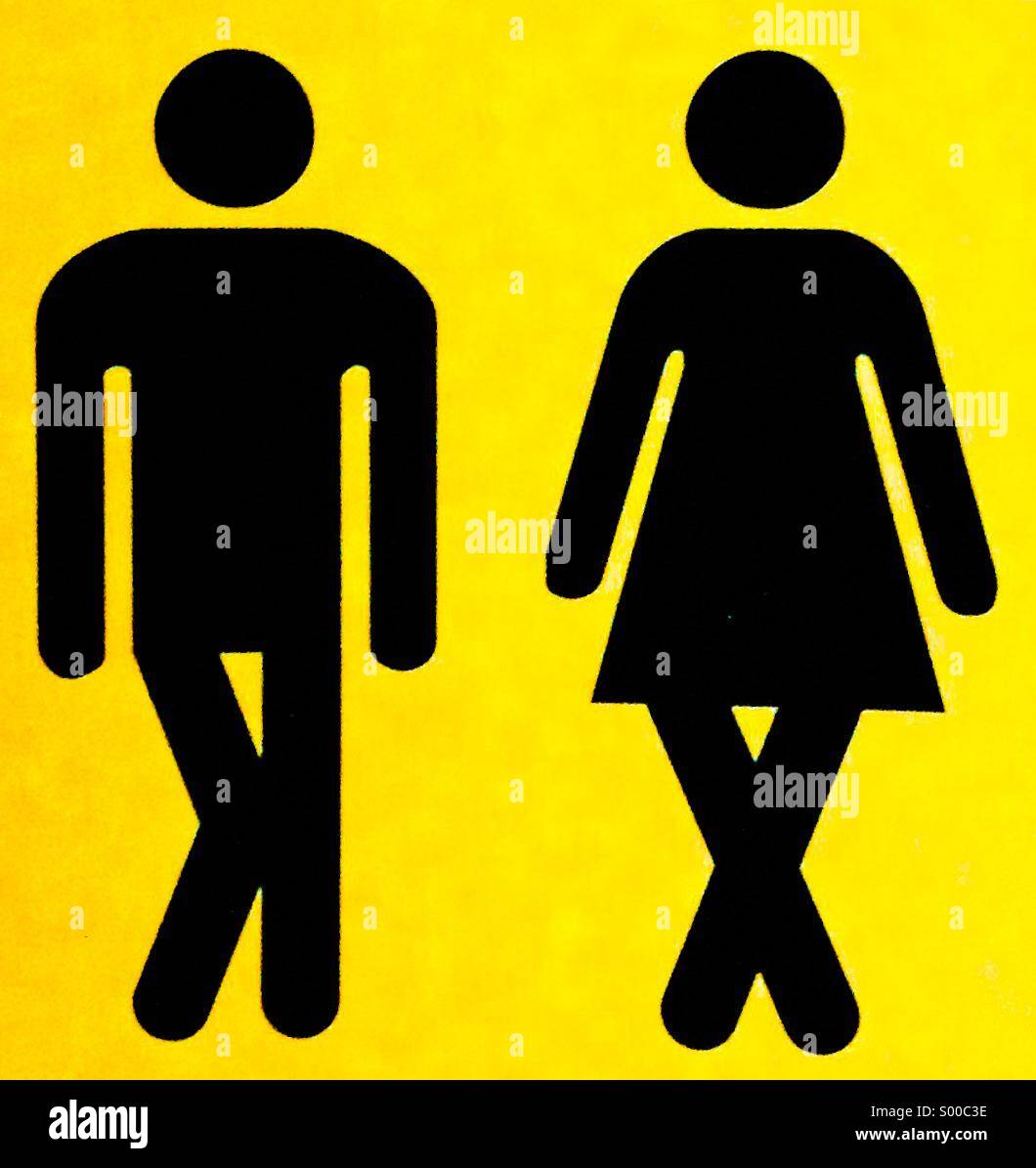 Ein Schild mit einem Mann und einer Frau mit gekreuzten Beinen. Stockfoto