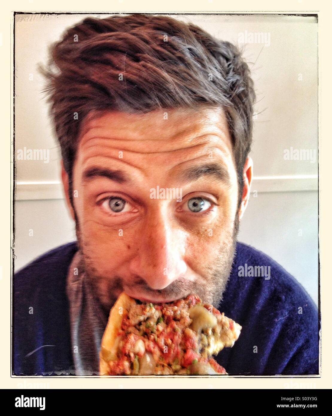 Essen Pizza Guy Stockfoto