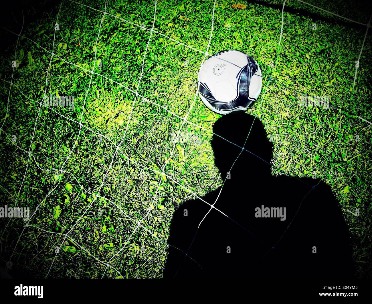 Schatten-Überschrift-Fußball Stockfoto