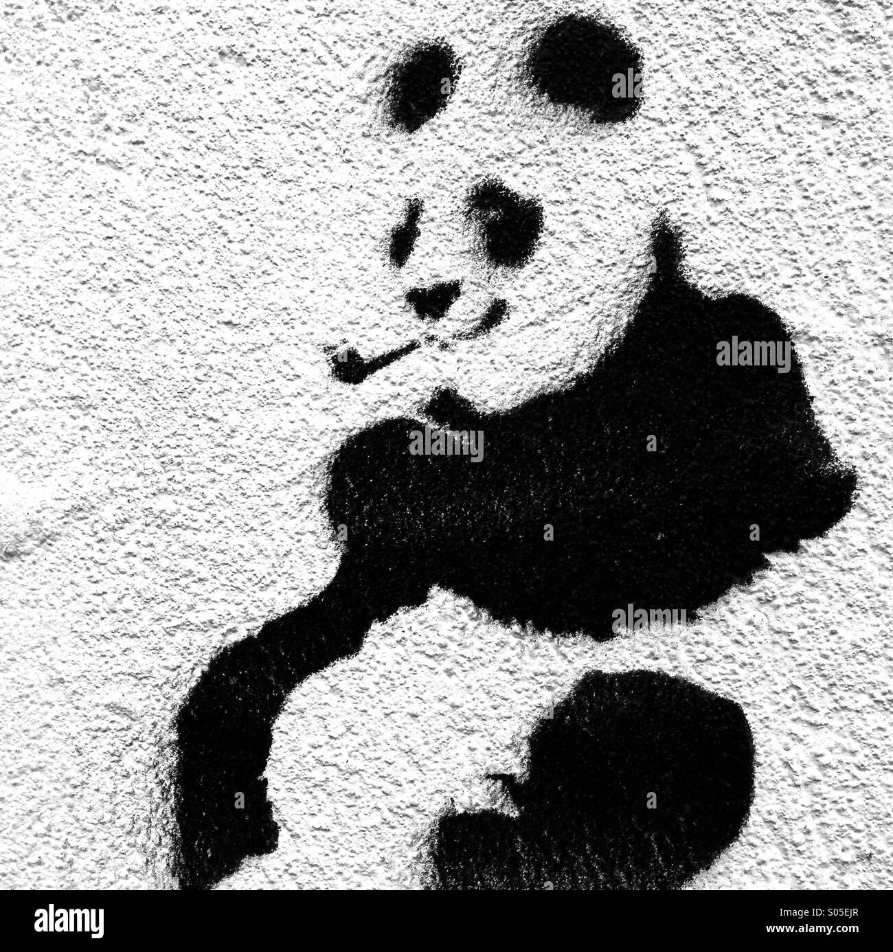 Schablone Kunst der Pfeife rauchenden Panda Stockfoto