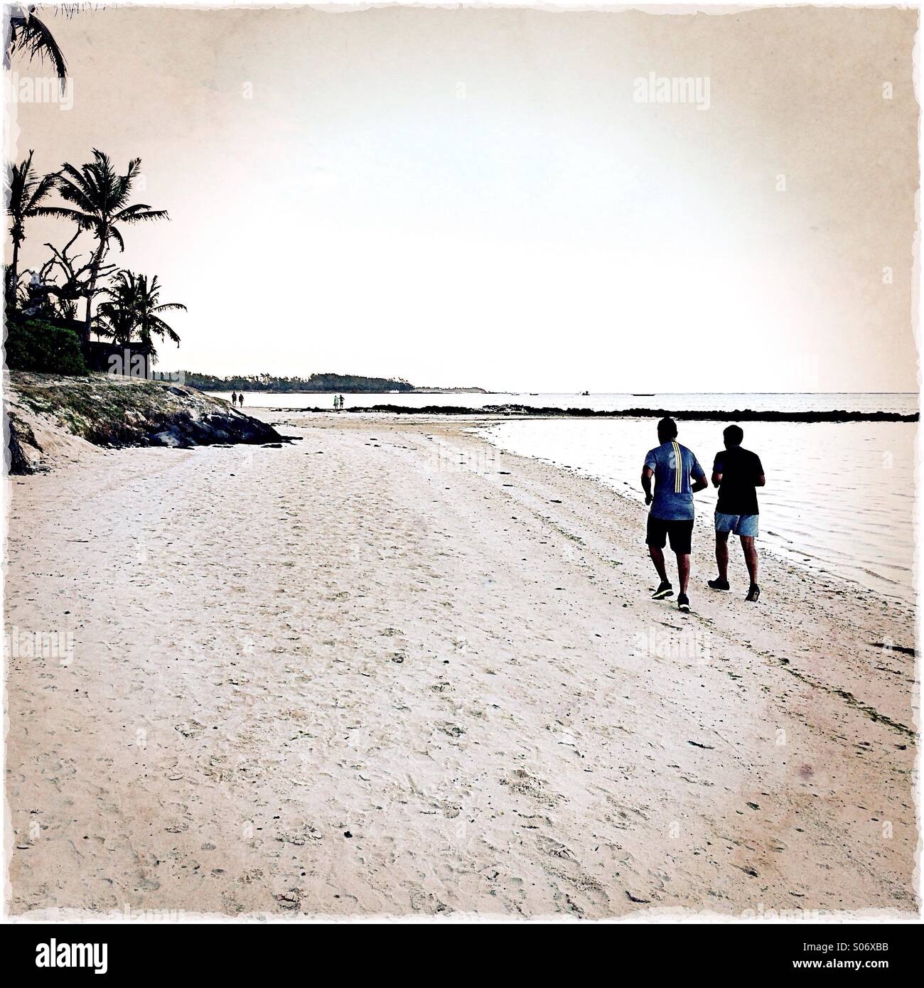 Menschen Joggen am Strand, Mauritius Stockfoto