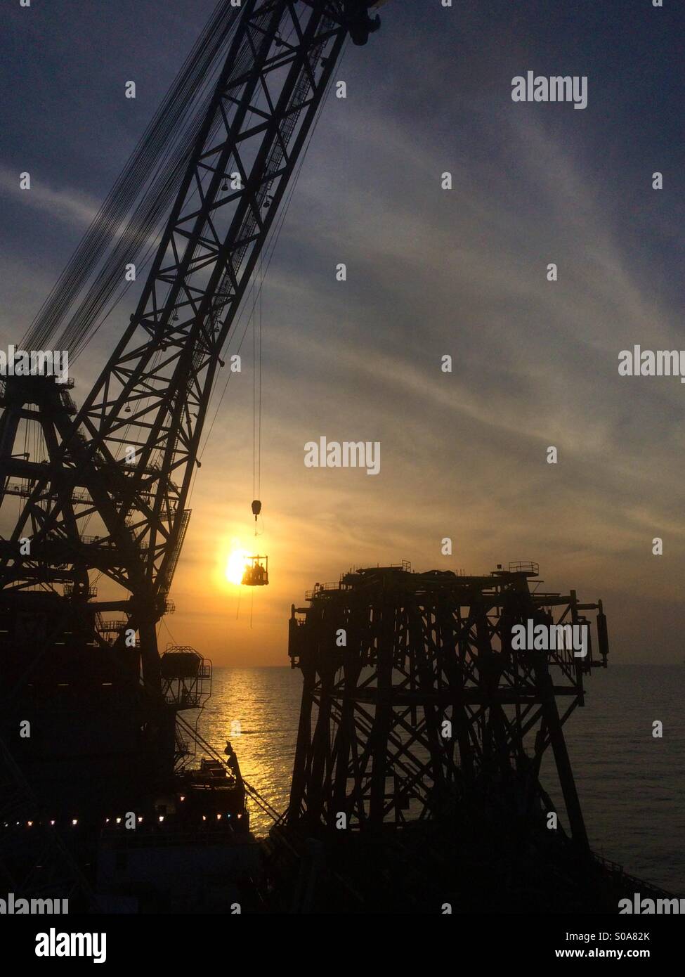 Offshore-Sonnenuntergang Stockfoto