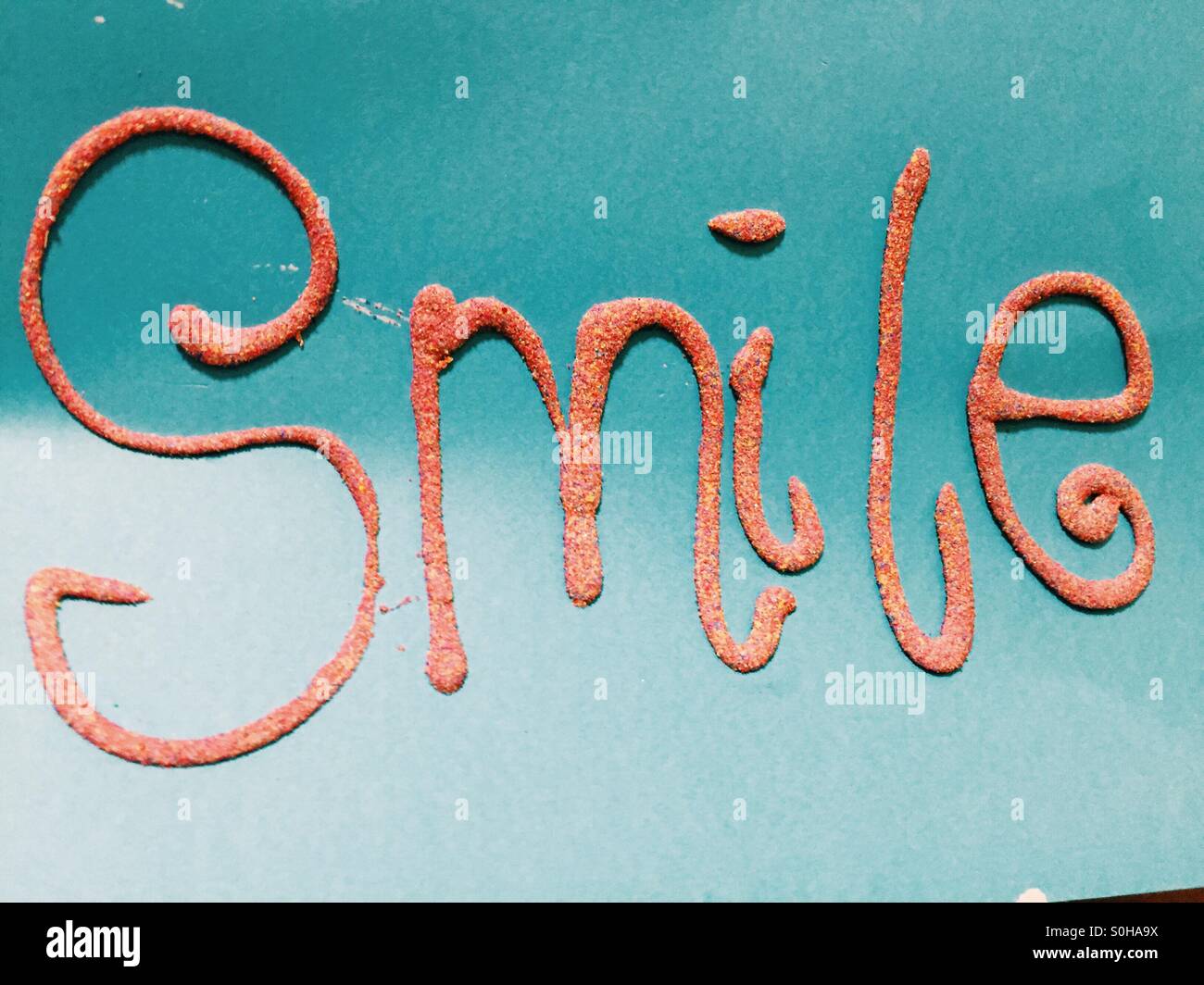 Lächeln aus sand Stockfoto