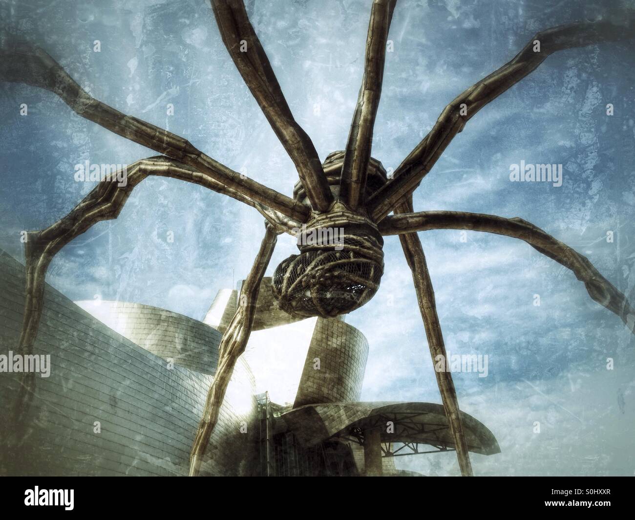Detail der Spinne Skulptur und das Guggenheim Museum in Bilbao, Spanien Stockfoto