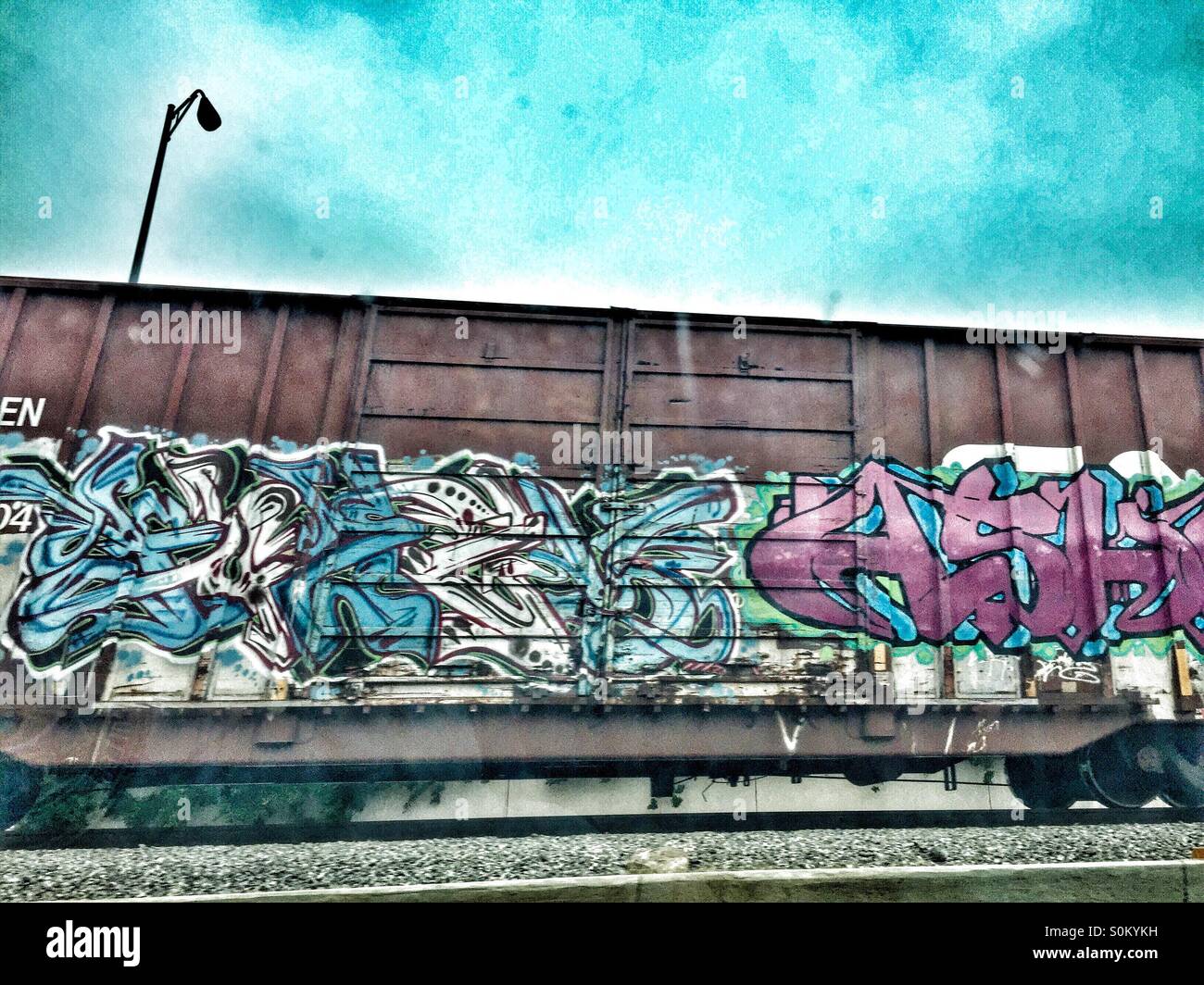 Graffiti an einem Güterwagen Stockfoto