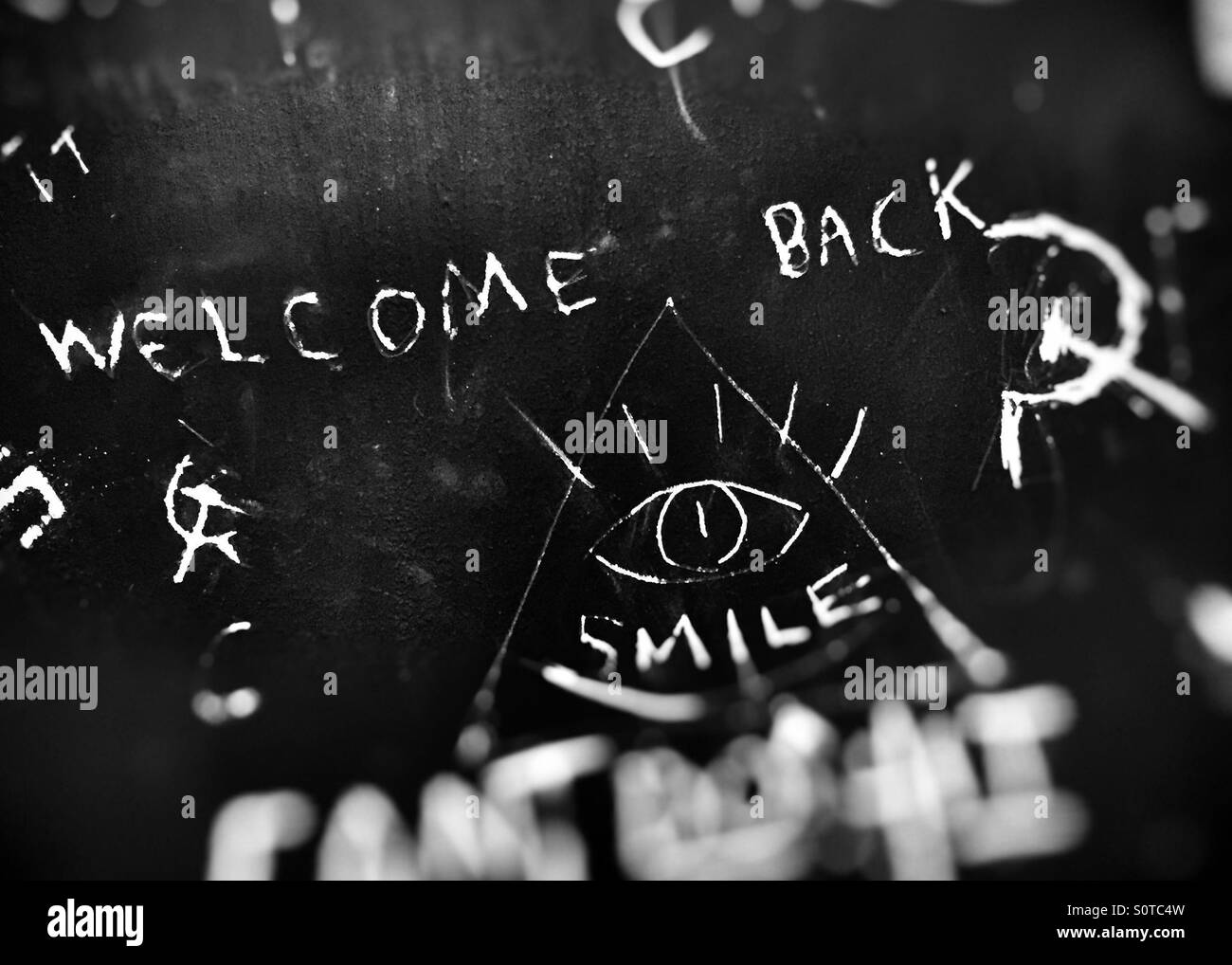 Willkommen zurück. Smile.Some graffiti Stockfoto