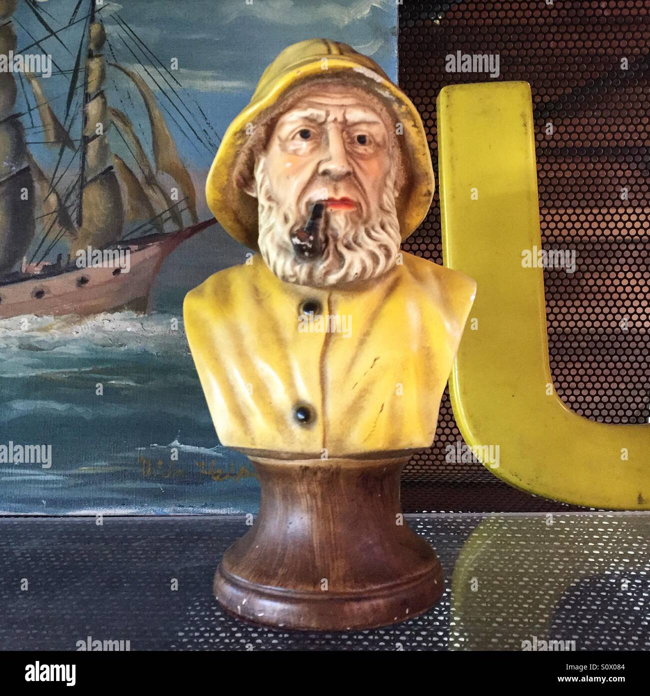 Alte Fischer statue Stockfoto