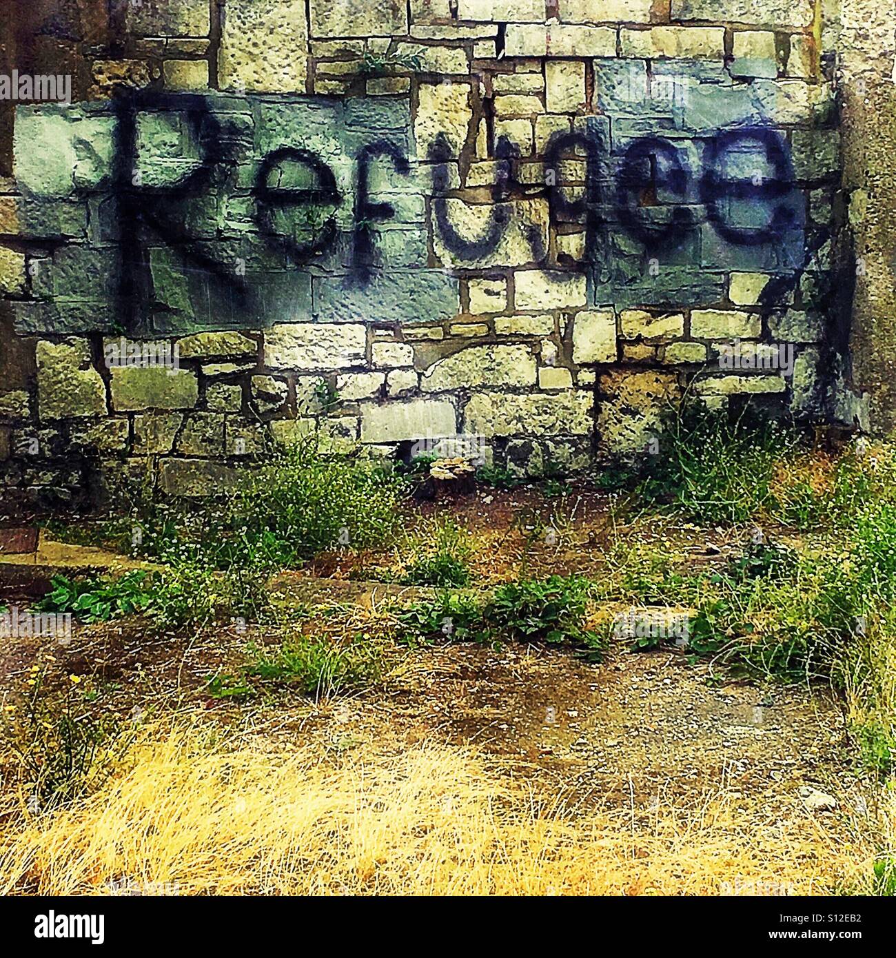 Flüchtling Graffiti an der Wand Stockfoto