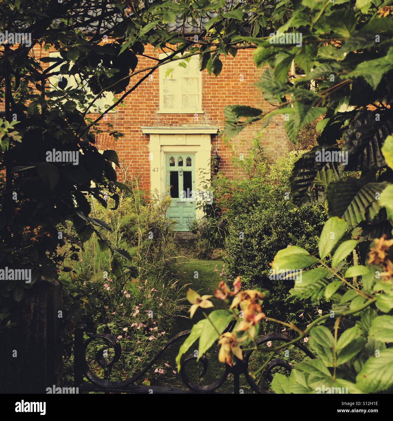 Geheimer Garten und Haus Stockfoto