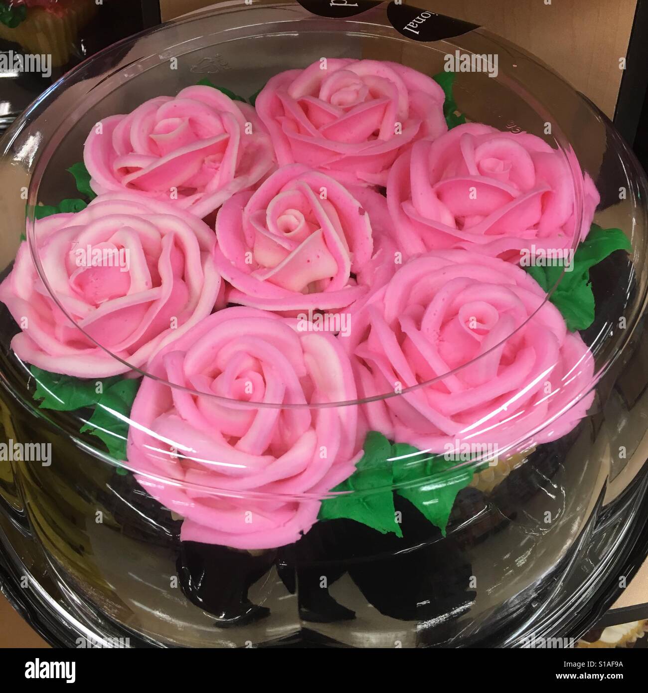 Rosa rose Kuchen Glasur - Smartphone-aufgenommenes Stockfoto